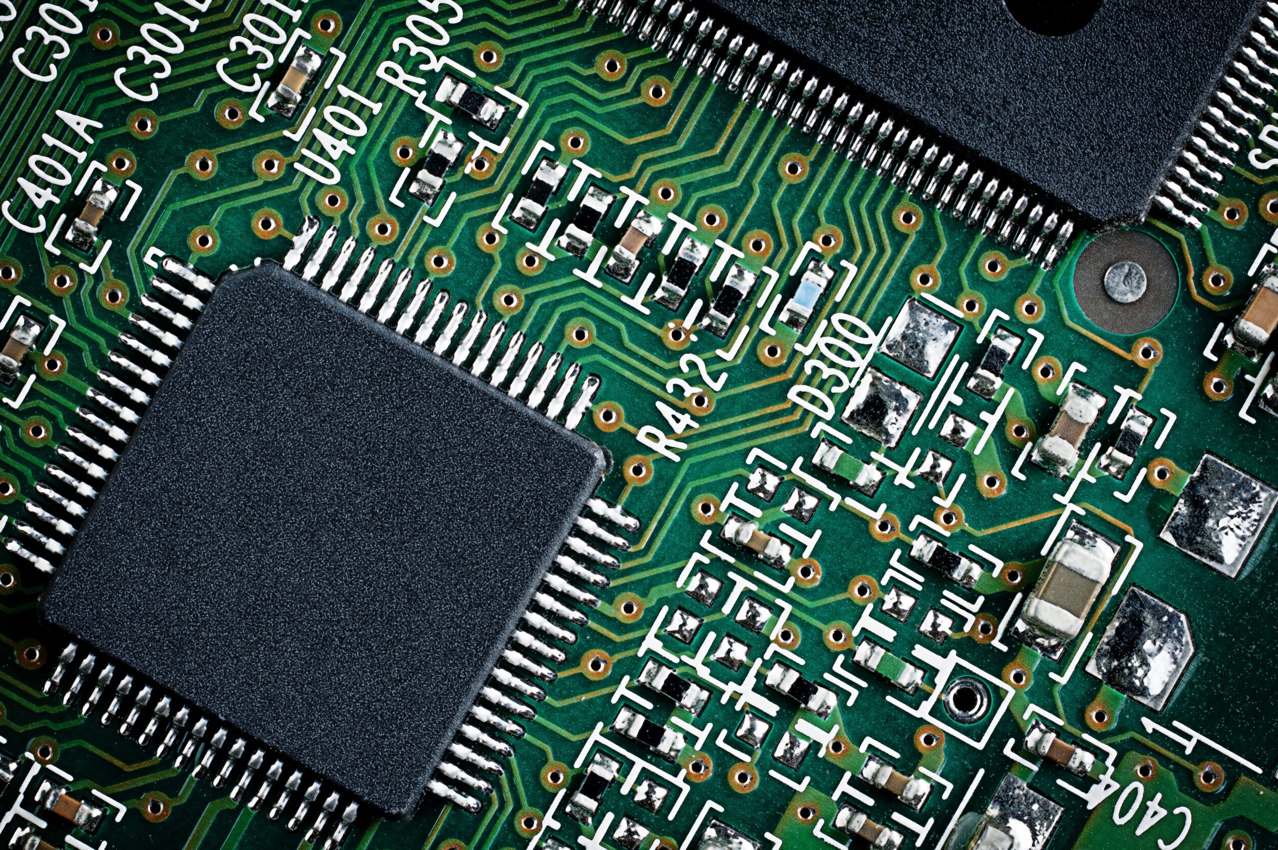 Close,Up,Detail,Of,Green,Microchip,Circuit,Board.