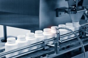 Healthcare, Industry. Medicine Pills Are Filling by a product created by the technology of a manufacturing company